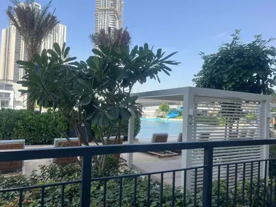 a view of the pool from the balcony of a resort at Vacationer l Contemporary 2 Bedroom l Pool, Gym, Private Beach Access in Dubai