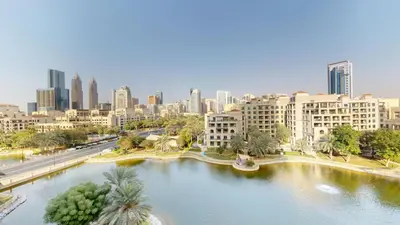 a view of a city with a river and buildings at Vacationer l Spacious Studio l Canal View l The Greens in Dubai