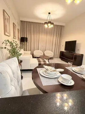 a living room with a couch and a table at Luxury Living in JVC 1BR Apartment in Dubai
