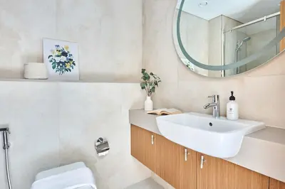 a bathroom with a sink and a mirror at Frank Porter - Azizi Mirage 1 in Dubai