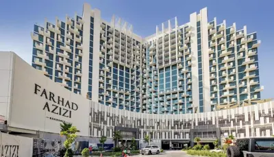 a large building with a sign in front of it at Sleek Modern Studio with Direct view of Dubai Skyline - Farhad Azizi Residence, Al Jaddaf by Deluxe Holiday Homes in Dubai