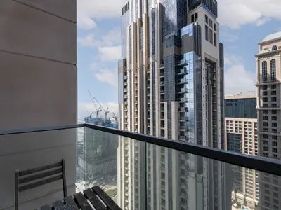 a balcony with a view of a city at Cozy and Elegant 1 BDR In Noura Tower-37 in Dubai