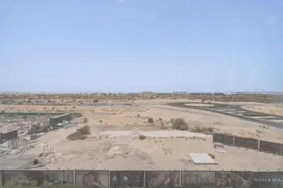 an aerial view of a construction site in the desert at StayShort - Spacious Studio in Town Square Sleeps 2 in Nadd Shubayḩ