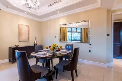 a dining room with a table and chairs at Luxury Old Town Fountain View 2BHK front of Dubai Mall in Dubai