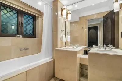 a bathroom with two sinks and a large mirror at Luxury Old Town Fountain View 2BHK front of Dubai Mall in Dubai