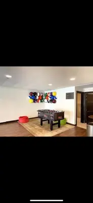 a living room with a ping pong table in a room at Luxury Old Town Fountain View 2BHK front of Dubai Mall in Dubai