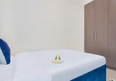 a bed in a room with a white mattress at Premium 2BR Downtown Dubai Near Burj & Dubai Mall Hosted by Desert City Stays in Dubai