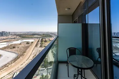 a balcony with two chairs and a view of a city at Aykon City Tower C, Business Bay - Onelink in Dubai