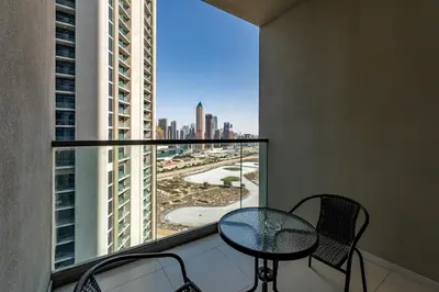 a balcony with a table and chairs and a view of a city at Aykon City Tower C, Business Bay - Onelink in Dubai