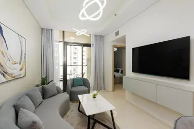 a living room with a couch and a flat screen tv at Aykon City Tower C, Business Bay - Onelink in Dubai