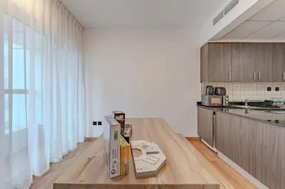 a kitchen with a table with a box on it at HAVN - 2 bedroom in Elite Residences, Dubai Marina in Dubai