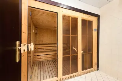 an open door to a room with a wooden closet at Vogue JLT Lake City Tower near Marina and JBR, Studio Apartment with Lake and City Skyline View, Access to all Amenities in Dubai