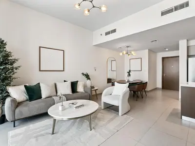 a living room with a couch and a table at Exquisite 2BDR Retreat In Forte-33 in Dubai