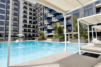 an empty swimming pool in a apartment building at Prime 2BR in Binghatti Crest - JVC in Dubai