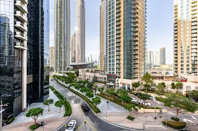 a city with tall buildings and a street with cars at Spacious 2 BDR apartment in Downtown Dubai I 29 Blvd in Dubai