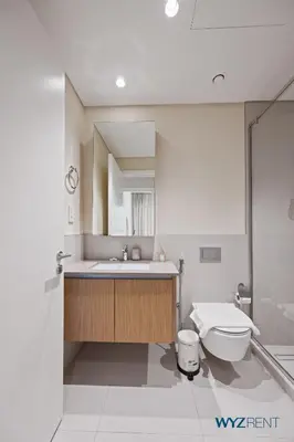 a bathroom with a sink and a toilet at Tranquil Boho 1BR in Surf 2 Creek Beach Access in Dubai