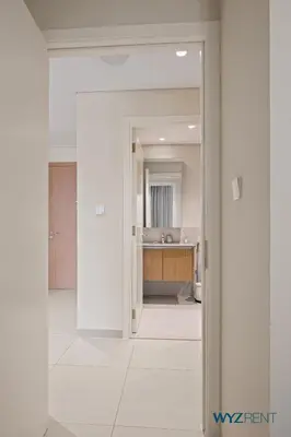 an open door into a kitchen with a sink at Tranquil Boho 1BR in Surf 2 Creek Beach Access in Dubai