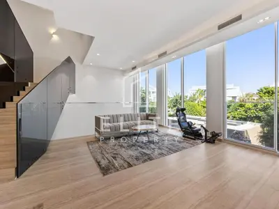 a living room with a couch and a chair at Luxury Ixora Family Villa in Dubai