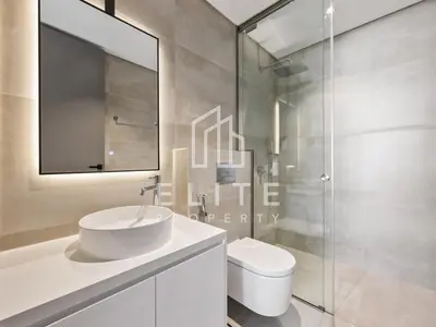 a white bathroom with a sink and a toilet at Luxury Ixora Family Villa in Dubai