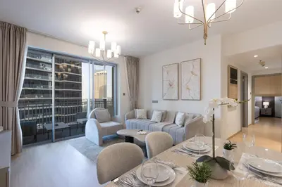 a living room with a couch and a table at Newly Upgraded 2BR - Steps from Burj Khalifa and Opera in Dubai