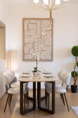 a dining room with a table and chairs at Newly Upgraded 2BR - Steps from Burj Khalifa and Opera in Dubai