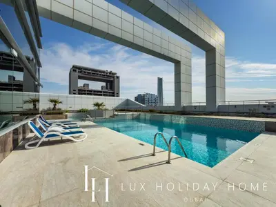 a swimming pool on the roof of a building at LUX The JLT Gold Crest Suite in Dubai
