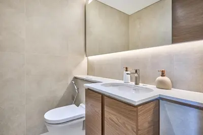 a bathroom with a white toilet and a sink at STAY BY LATINEM Luxury 1BR Holiday Home CVG2403 Near Downtown in Dubai