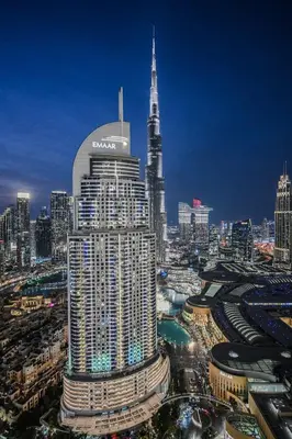 a view of a large city at night at Ultra Luxury 4BR 7P Burj and Fountain View in Dubai