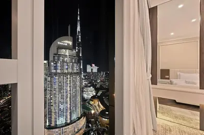 a room with a view of a city skyline at Ultra Luxury 4BR 7P Burj and Fountain View in Dubai