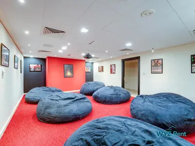 a room with four blue bean bags on a red carpet at Upscale 1BR Loft Central Walk to Burj Khalifa&Mall in Dubai