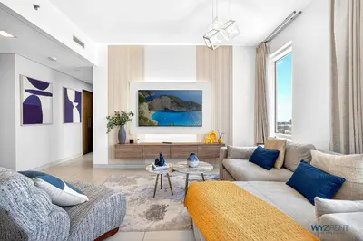 a living room with a couch and a table at Upscale 1BR Loft Central Walk to Burj Khalifa&Mall in Dubai