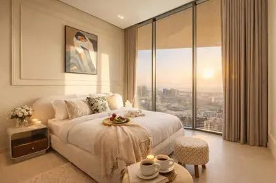 a hotel room with a bed and a large window at Luxury Apartment in JVC with Private Balcony Pool in Dubai