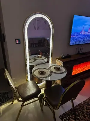 a living room with two tables and a mirror at Luxury Skyline View Apartment - Binghatti Tulip 1401 in Dubai