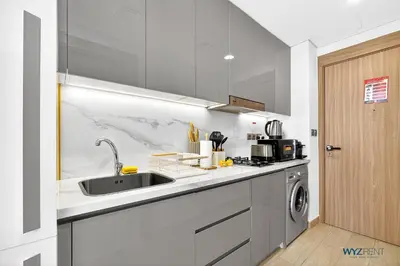 a kitchen with a sink and a dishwasher at Winter Wonderland Studio Azizi Riviera 9 Pool View in Dubai