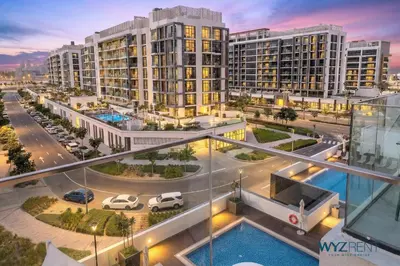 an aerial view of a city with tall buildings at Winter Wonderland Studio Azizi Riviera 9 Pool View in Dubai