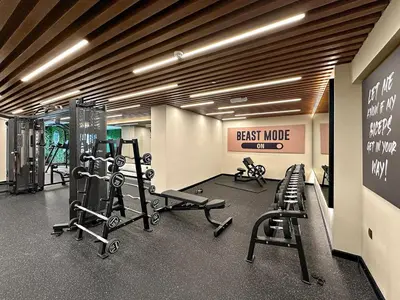 a gym with treadmills and exercise equipment in a building at FIRST CLASS Studio Iconic Burj Khalifa View in Dubai