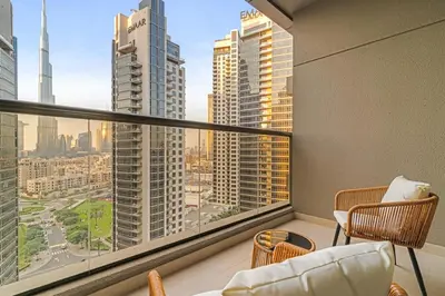 a living room with a view of a city at FIRST CLASS Studio Iconic Burj Khalifa View in Dubai