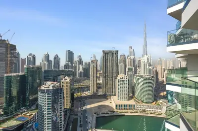 a view of a city skyline with tall buildings at Upscale Studio with Peninsula Lifestyle in Dubai