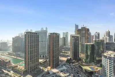 an aerial view of a city with tall buildings at Upscale Studio with Peninsula Lifestyle in Dubai