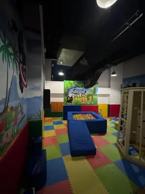 a room with a play room with a colorful floor at Modern 1BR Marina 3mins walk to JBR Beach & Tram in Dubai