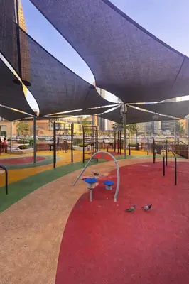 a playground with pigeons on a red carpet at Modern 1BR Marina 3mins walk to JBR Beach & Tram in Dubai