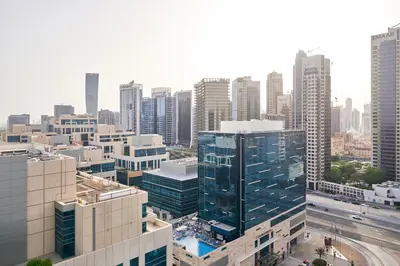 an aerial view of a city with tall buildings at Luxury Studio Cozy & comfy 12 Min Walk-Dubai Mall in Dubai