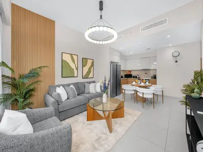 a living room with a couch and a table at Luxury 2BHK with view of Burj Khalifa & Fountain in Dubai