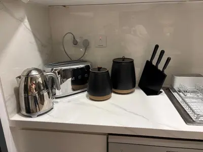 a kitchen counter with appliances on a counter top at Prime Pool Location Spacious Family Villa in Dubai