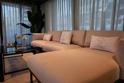 a living room with a couch with pillows on it at Luxury Yacht in Dubai Marina - Private Charter in Dubai
