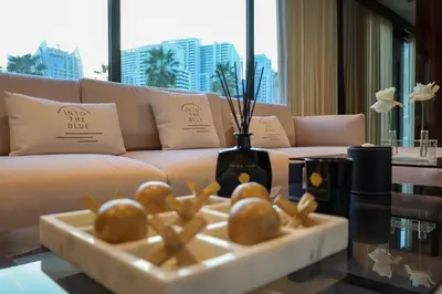 a living room with a couch and a table with food at Luxury Yacht in Dubai Marina - Private Charter in Dubai