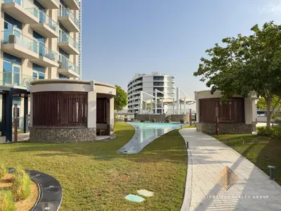 a skate park in front of a building at Elegant Studio with Resort Amenities at Miraclez in Dubai