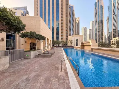 a swimming pool in a city with tall buildings at Perfect Getaway in Downtown l Near Dubai Mall in Dubai