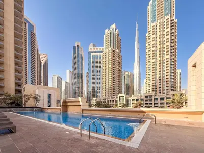 a swimming pool in a city with tall buildings at Perfect Getaway in Downtown l Near Dubai Mall in Dubai
