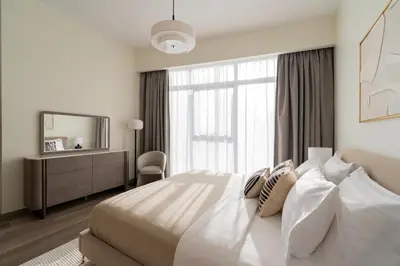 a bedroom with a large bed and a mirror at Downtown Dubai - Near Burj Khalifa & DWTC-Gulfood - Imperial Avenue in Dubai